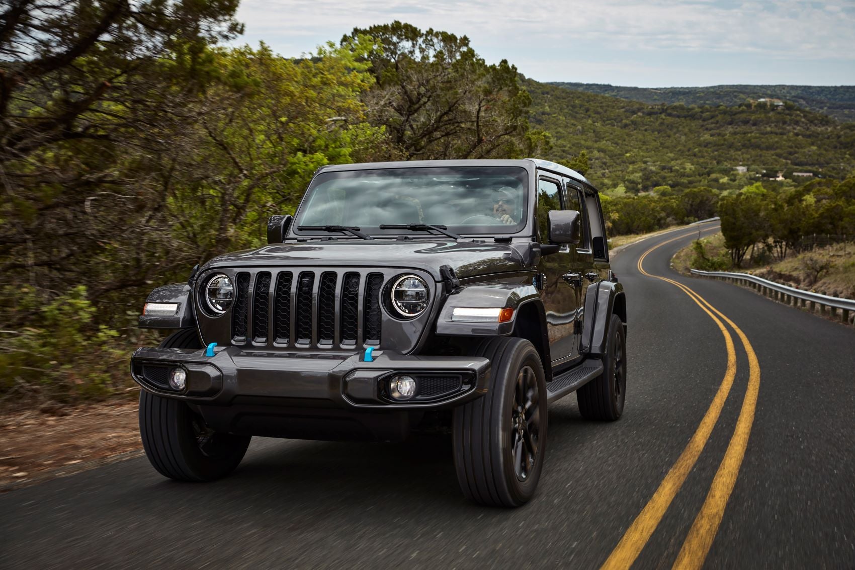 Jeep Wrangler driving down road